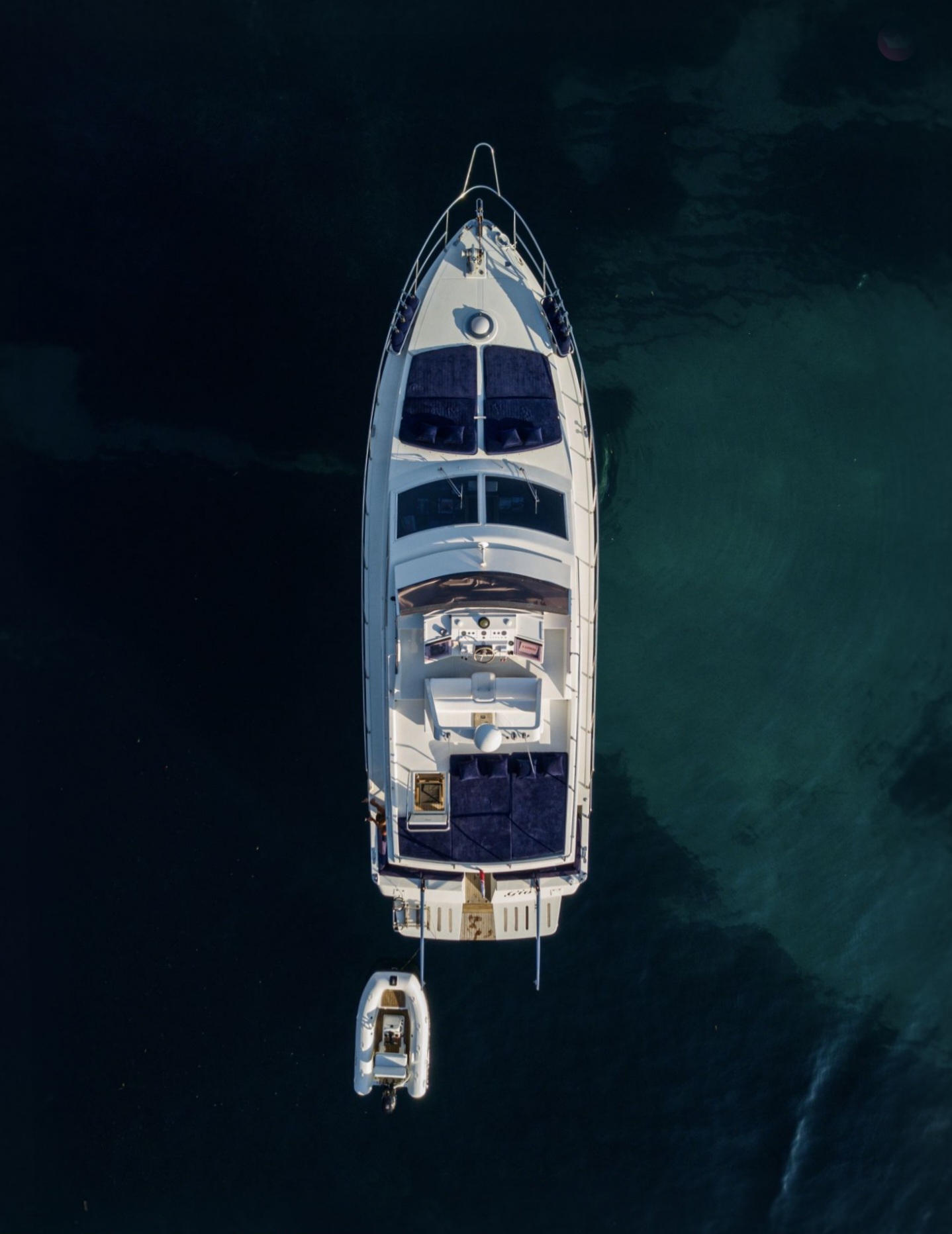 Aerial view of M/Y Gio in clear water